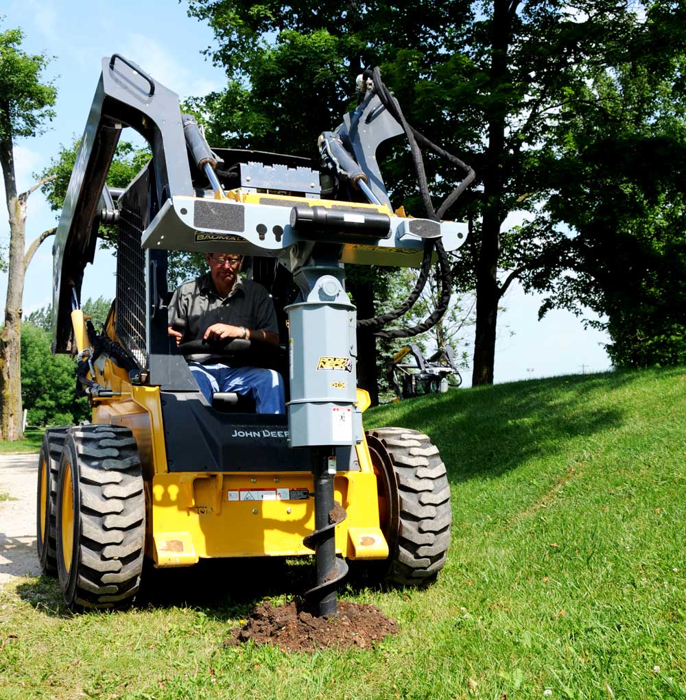Compact Loader With Auger Attachment